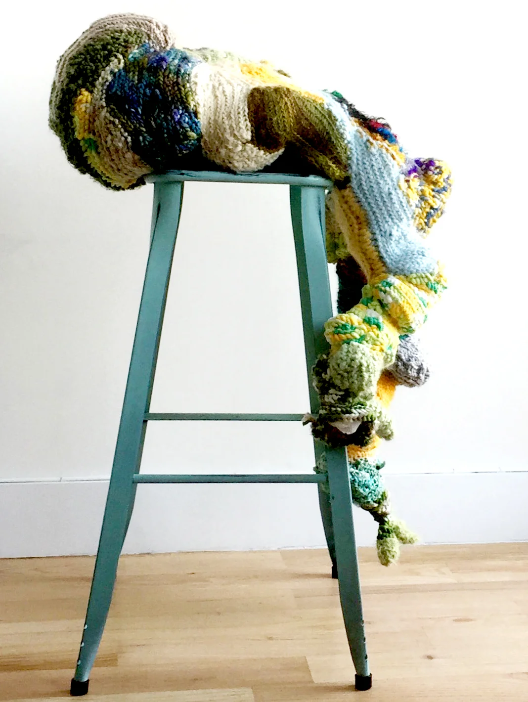 seat at the table 39 x 26 x 21 inches Yarn, upcycled grocery bags (stuffing), stool. This full figured, generative body is claiming a seat at the table. Herbalists in indigenous cultures are revered, seen as central to a community, essential for life. They have power. I descend from Irish Herbalists on both sides of my family. In the 1700's the native Irish were forbidden to have a profession, own land or speak their own language. My family had no consciousness of this auspicious past until I attended a residency in Ireland in 2017. Reclaiming this knowledge is an act of resistance, a radical feminist act. My work has always been about re-empowering the traditionally feminine roles I've embodied - Mother, Nurse, Herbalist along with Care-based activities like crocheting.