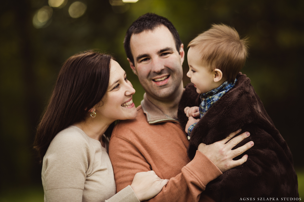 family of three-9 month old baby boy wrapped in blanket | cleveland, ohio portrait photographer