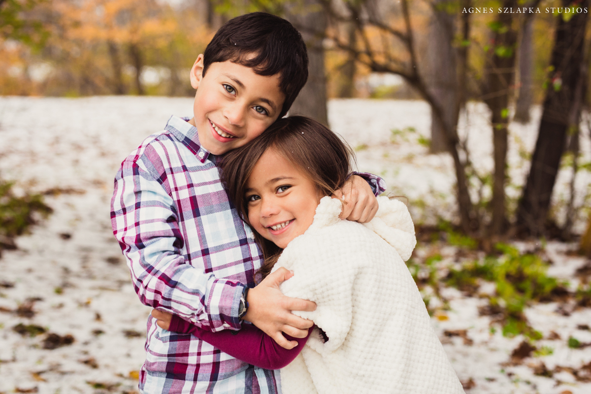 siblings brother and sister holding close on winter day | cleveland, ohio kids photography