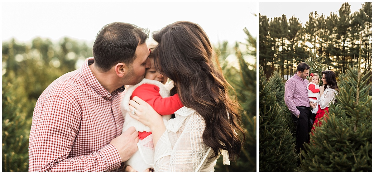 mom and dad kissing one year old daughter-christmas | cleveland, OH family photos