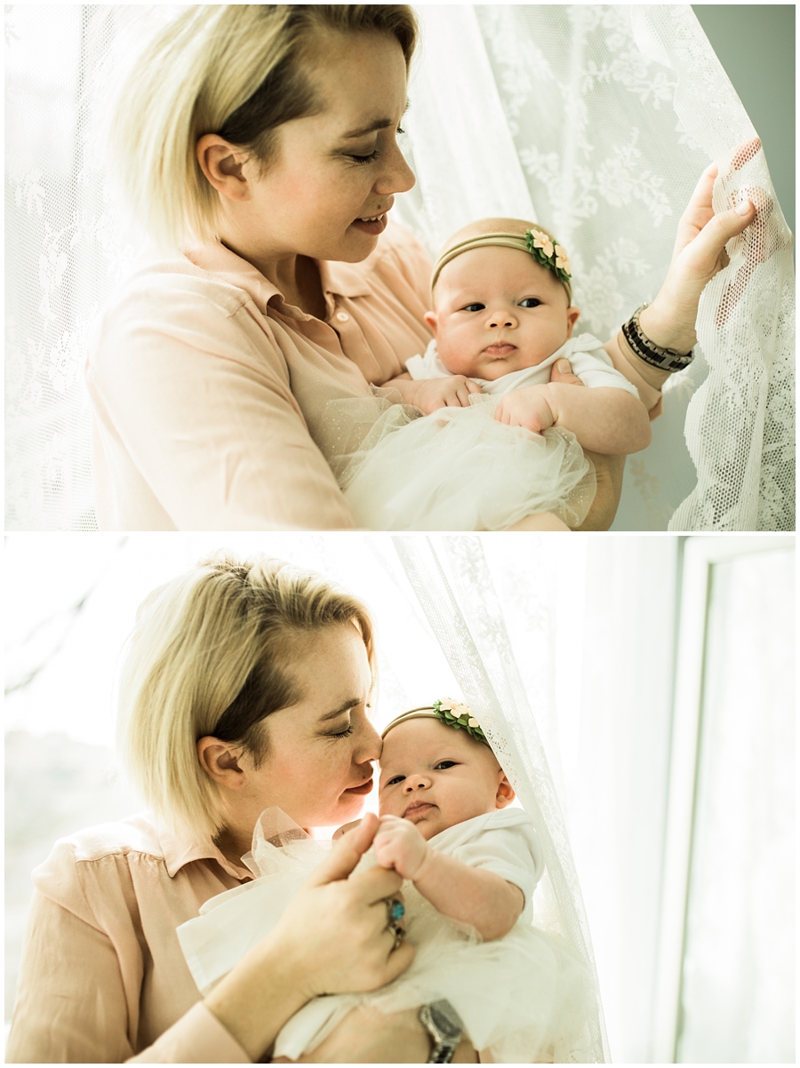 baby girl with mommy near window curtains | cleveland, OH lifestyle newborn photographer