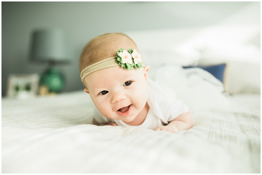 two month old infant baby girl on bed | cleveland, Ohio baby photographer