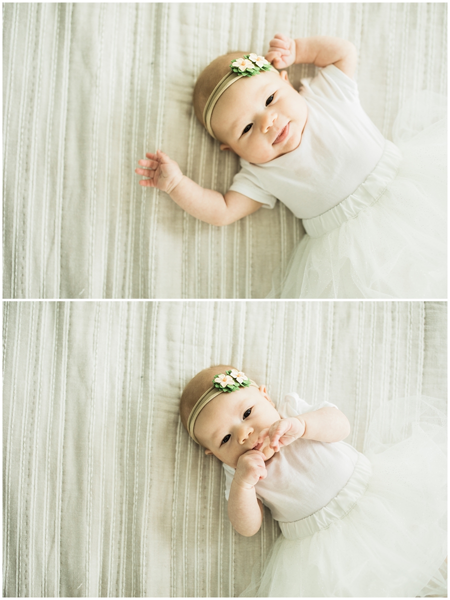 two month old infant baby girl on bed | cleveland, Ohio baby photographer
