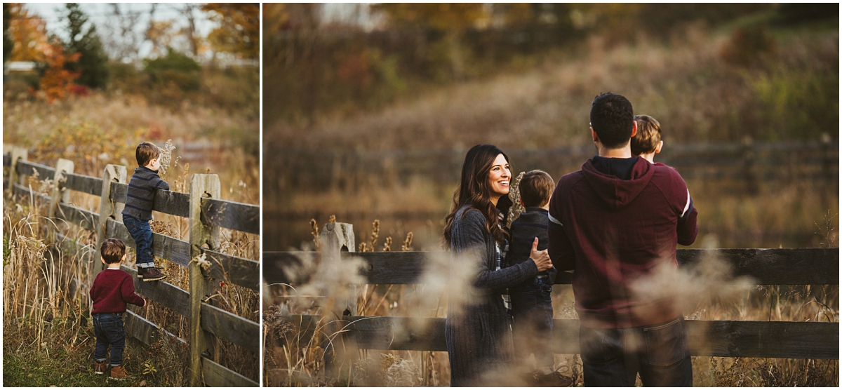 two boys climbing fence in beachwood park | cleveland, OH family lifestyle photographer