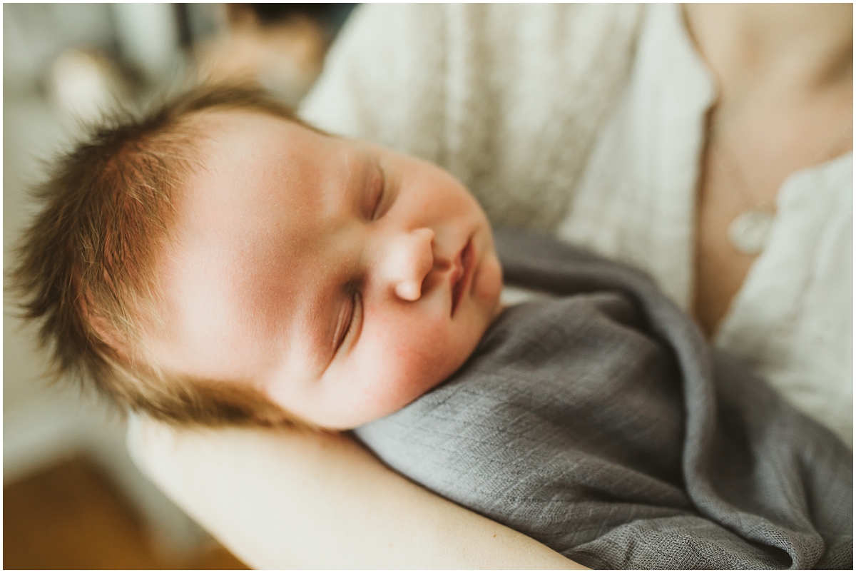 infant baby boy in blue swaddle | cleveland, OH newborn photographer