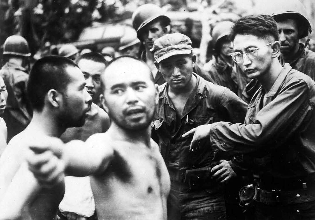 Harry interrogating Japanese prisoners of war in Aitape, New Guinea in April 1944.
