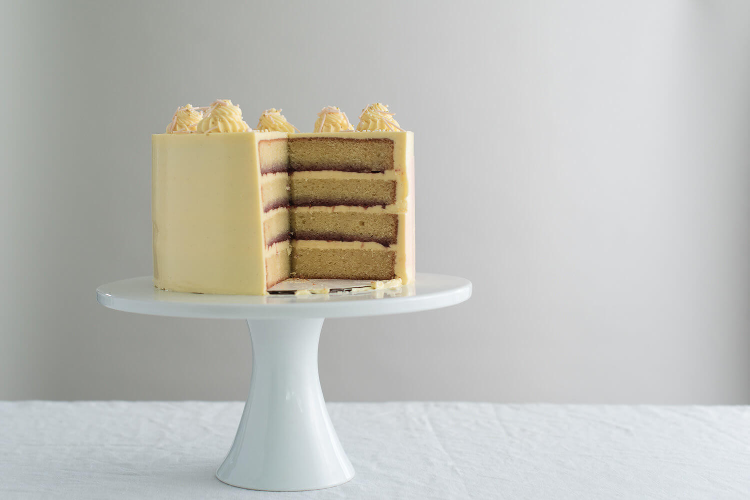sliced organic vanilla cake raspberry jam.jpg