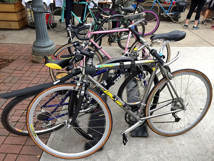 Classic Litespeed, and there's the cool pink Schwinn further down. Giro stylz.