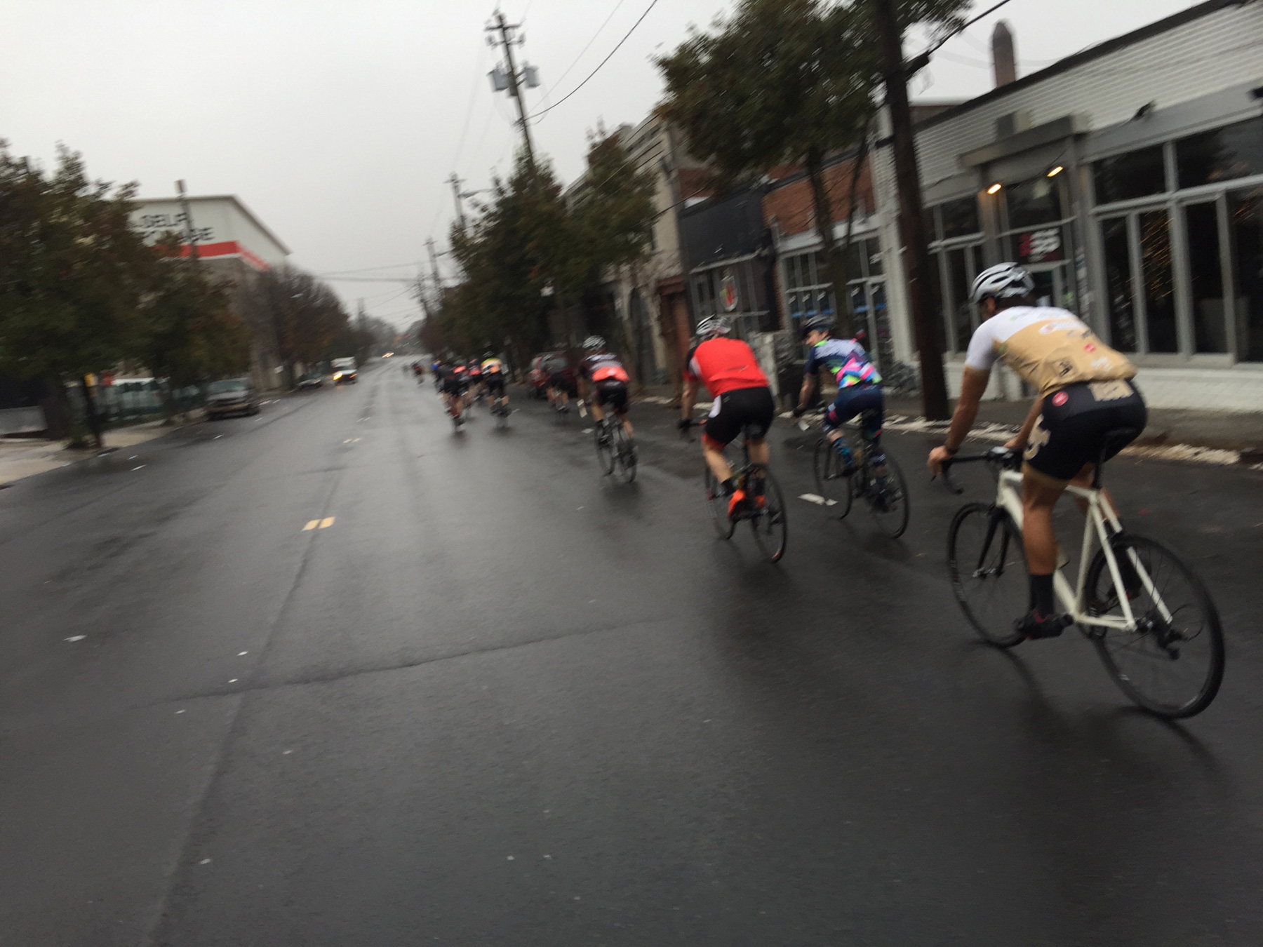 The small peloton departs - it was a rainy morning.