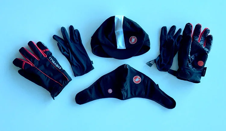 Hat with extra insulation, winter glove with glove lining, and face mask.
