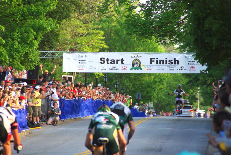 “For the win” I like the different point of view. Typically a finish line shot is taken with the riders approaching. I like the way this one turned out because it still tells the story of this race as it ends. The spectator excitement, the winner and the ensuing sprint for second.
