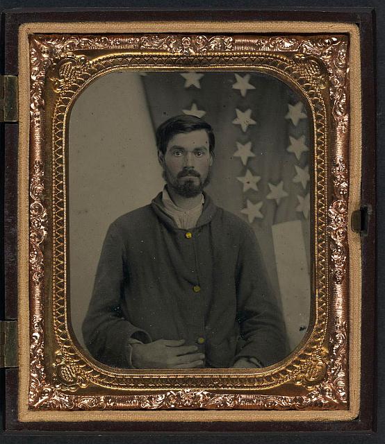 Soldier in Union Sack Coat in Front of American Flag | Circa 1861-1865
