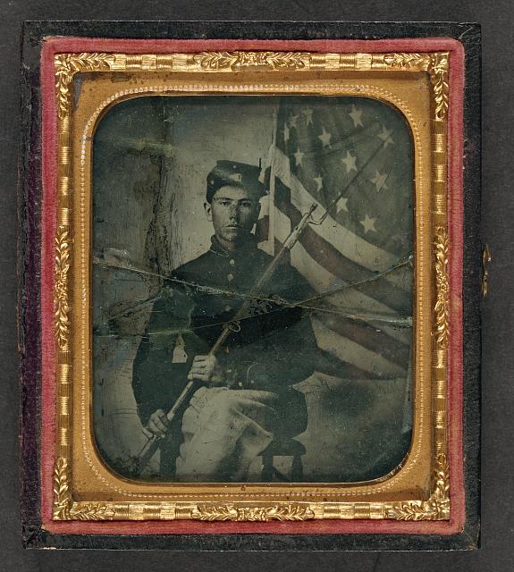 Soldier in Union Uniform with Bayoneted Musket in Front of American Flag | Circa 1861-1865