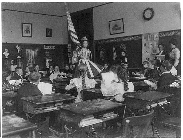 Public School Students in Art Class Sketching Live Model Wearing Stars and Stripes Dress and Holding U.S. Flag, 3rd Division Washington, D.C. | Circa 1899