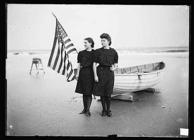 Women by Boat with Flag in Atlantic City | Circa 1890