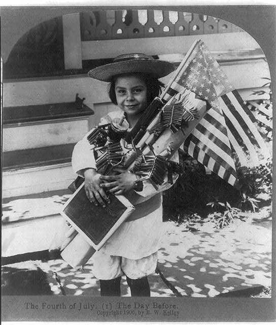 Child with the American Flag and Fireworks | Circa 1906