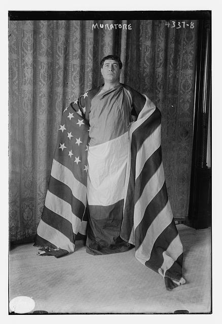 Muratore Draped in the American Flag | Circa 1900