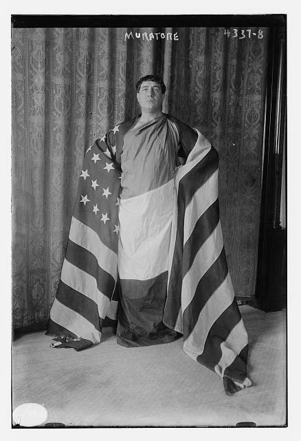 Muratore Draped in the American Flag | Circa 1900