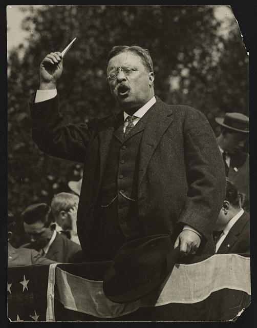 Teddy Roosevelt Speaking from a Flag Draped Platform | Circa 1900