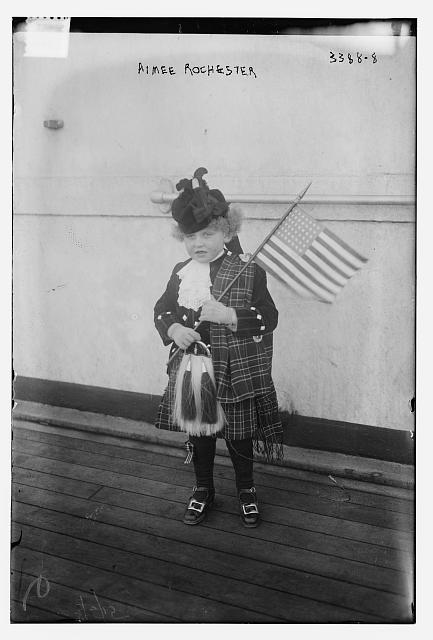 Aimee Rochester in Scottish Kilt Holding an American Flag | Circa 1910