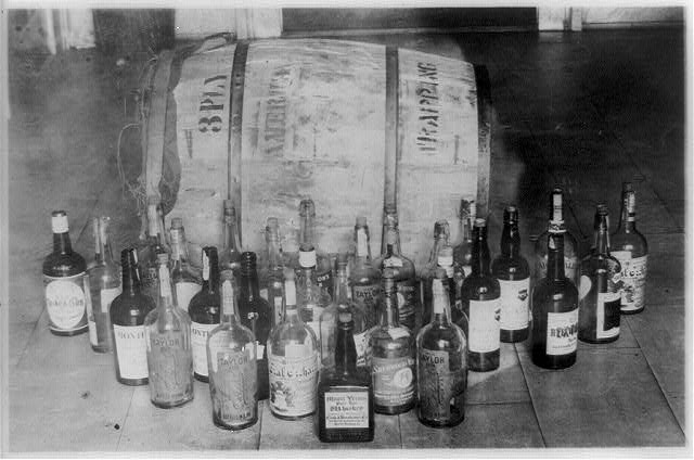 Bottles and a Barrel of Confiscated Whiskey | Circa 1921