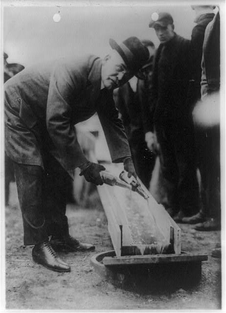 W. Hurd Clendinen, Mayor of Zion City, Pouring Away Two Bottles of Beer | Circa 1921