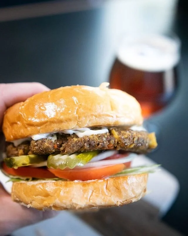 Featuring our house vegetarian patty with Surata tofu, bread crumbs, veggies, and herbs, and then topped with a heap of classic burger fixings, our Earth Burger is sure to please our vegetarian friends&mdash;and confidently get some meat-eaters pumpe