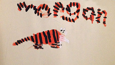 This girl carried her tiger's stripe pattern into the design of the letters in her name!