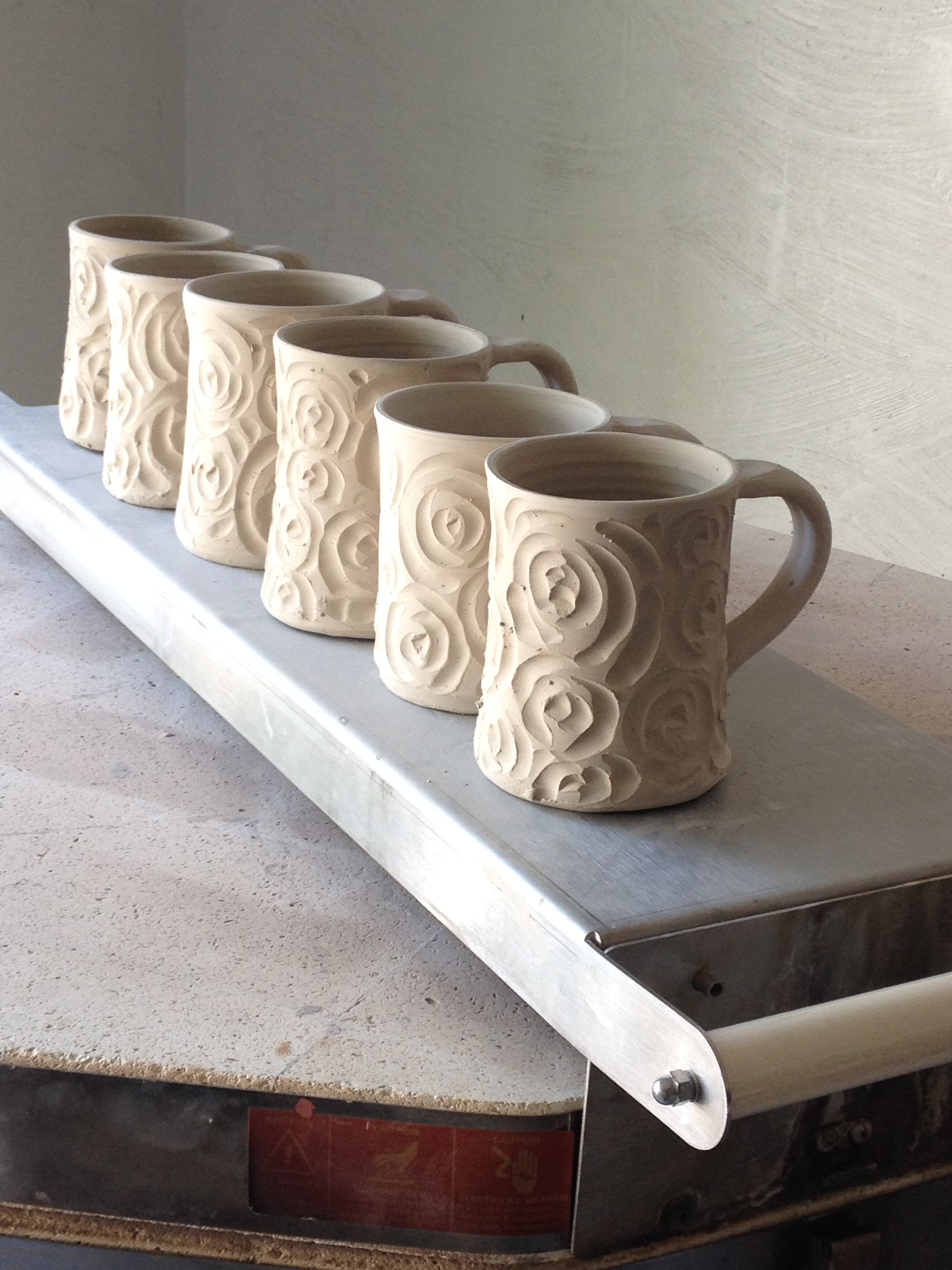 Carved mugs drying.jpg