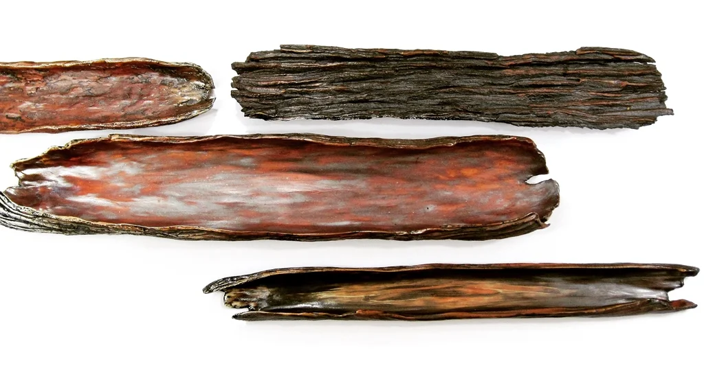 Peels of Bark Finding long peels of tree bark along the trail inspired these dishes. I use only food safe glazes so these trays can be used to serve hors d'oeuvres by placing foods inside or by displaying special dainties along the textured back. I also line these with tealights to create a unique display down the center of a table or mantle.