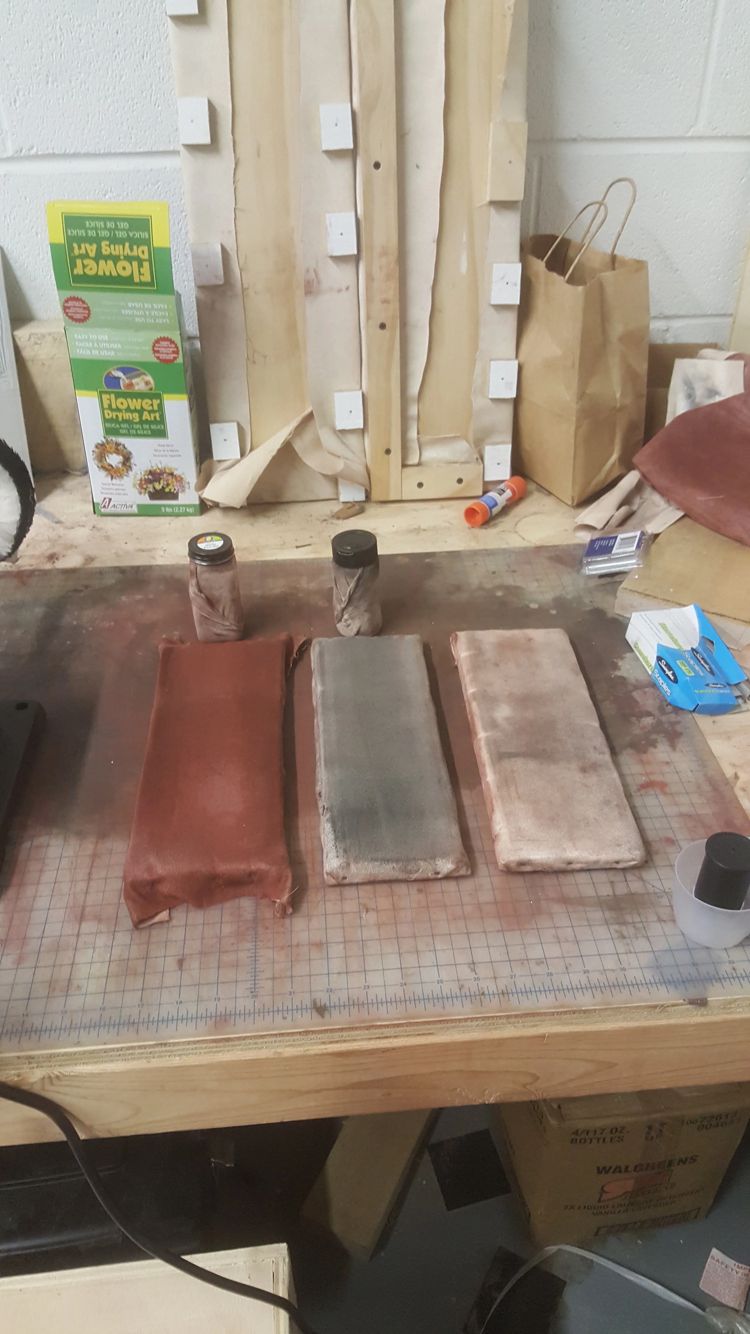 my small microsuede buffing paddles, in order: rouge, lamp black (carbon), and "clean." 