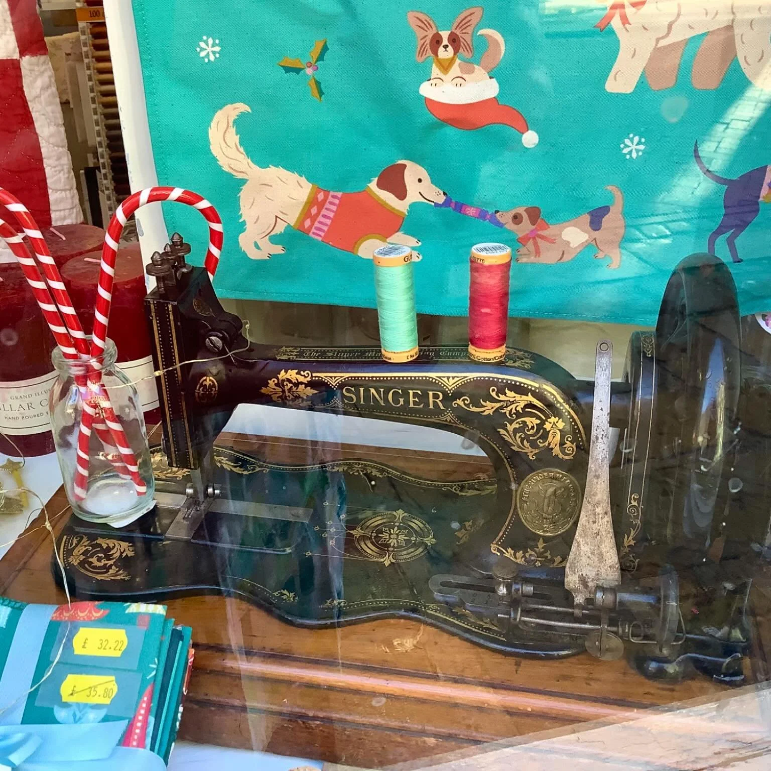 Our Christmas window is a moveable feast. Today we sold this gorgeous vintage Singer sewing machine, raising money for local charity, Tools with a Mission. We were most impressed as lucky customer Tansy was taking it home on the train! You go girl - 