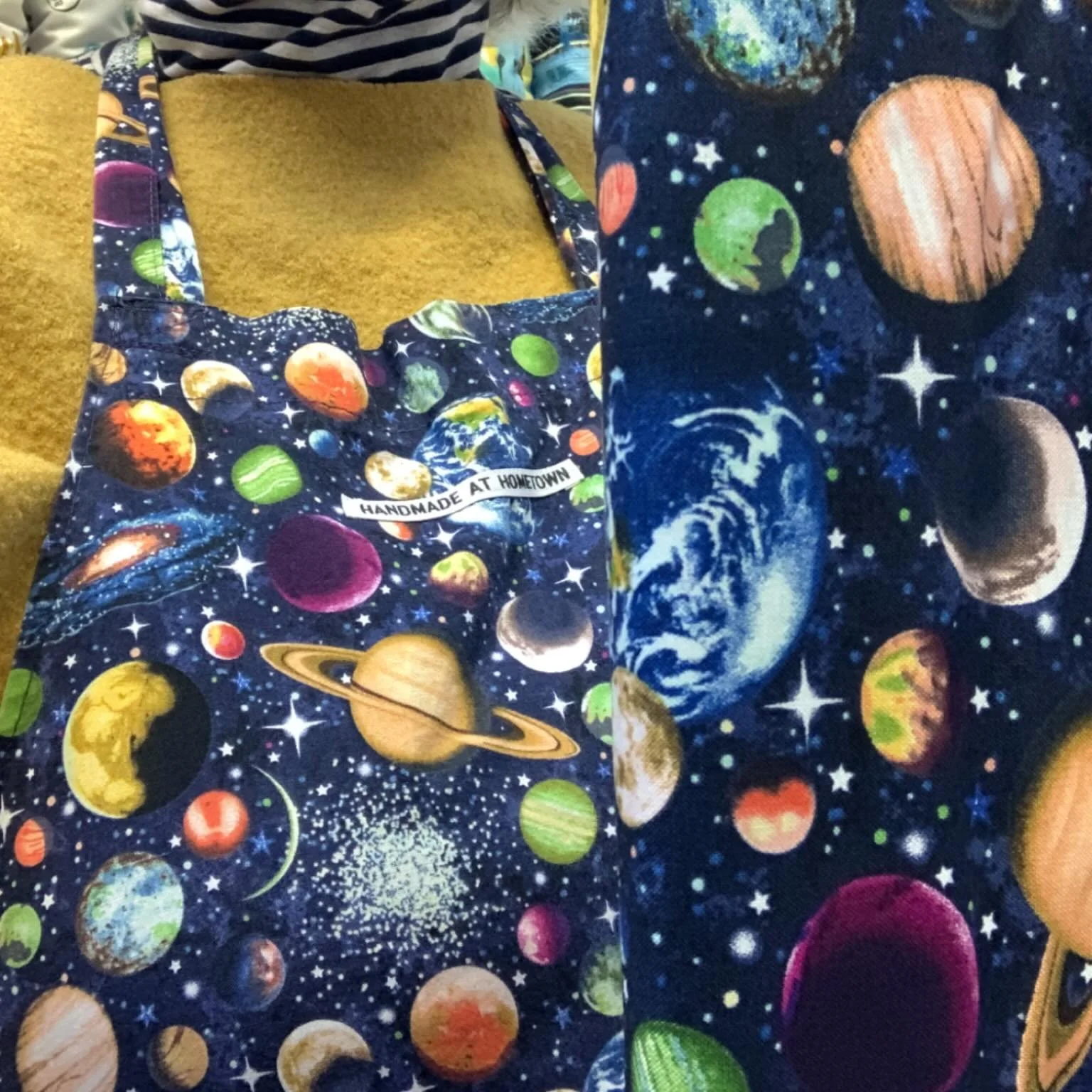 Synchronicity! Wearing one of my favourite work aprons today and look what fabric was delivered this morning&hellip; 🪐🌝

Plus, the box contained loads of new prints, (which if you&rsquo;re under 10 or young-at-heart will have you squealing for a ne