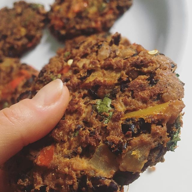 My test kitchen has been filled with grab-and-go experiments to work with my crazy schedule, and these black bean veggie burgers are making their way into the official weekly lineup (and cookbook). They may not look like much, but don&rsquo;t let the