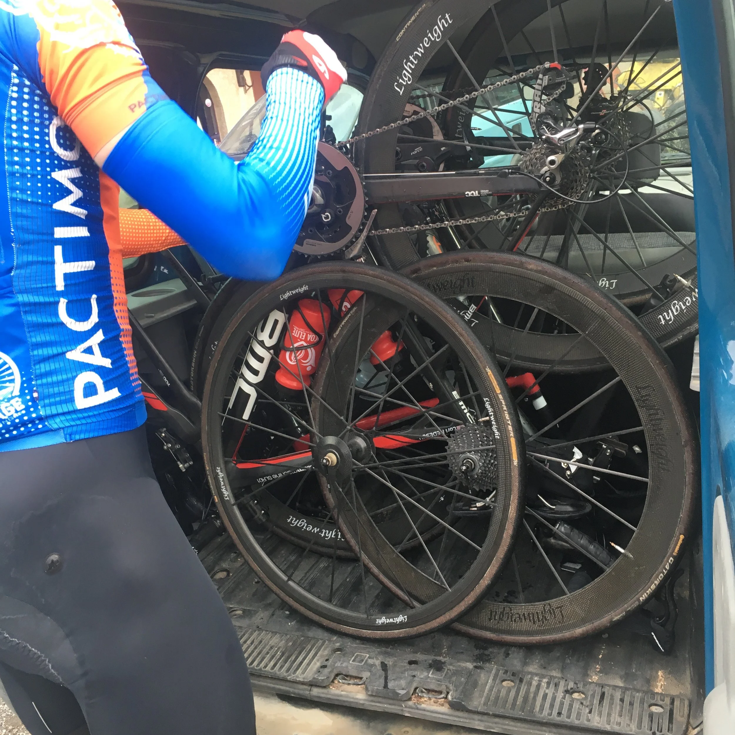 4 people, 3 bikes, 1 tiny 'van'. 