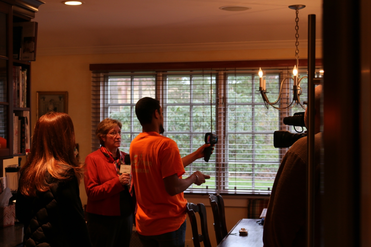 Mayor Radest looks on as John demonstrates the capabilities of his thermal imaging camera.