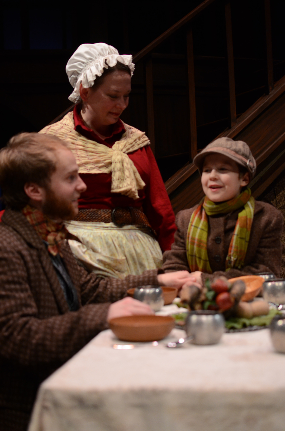 Nate Stahlke, Kathy Logelin, and Noah Chacon in A Christmas Carol (2013). Bettencourt Chase Photography. 