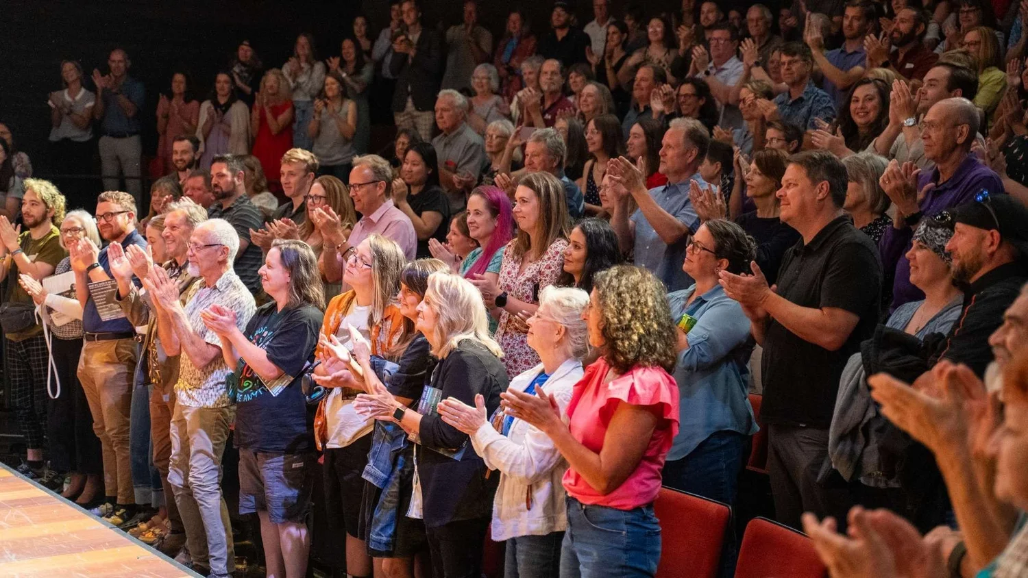 An audience applauding at TheatreSquared