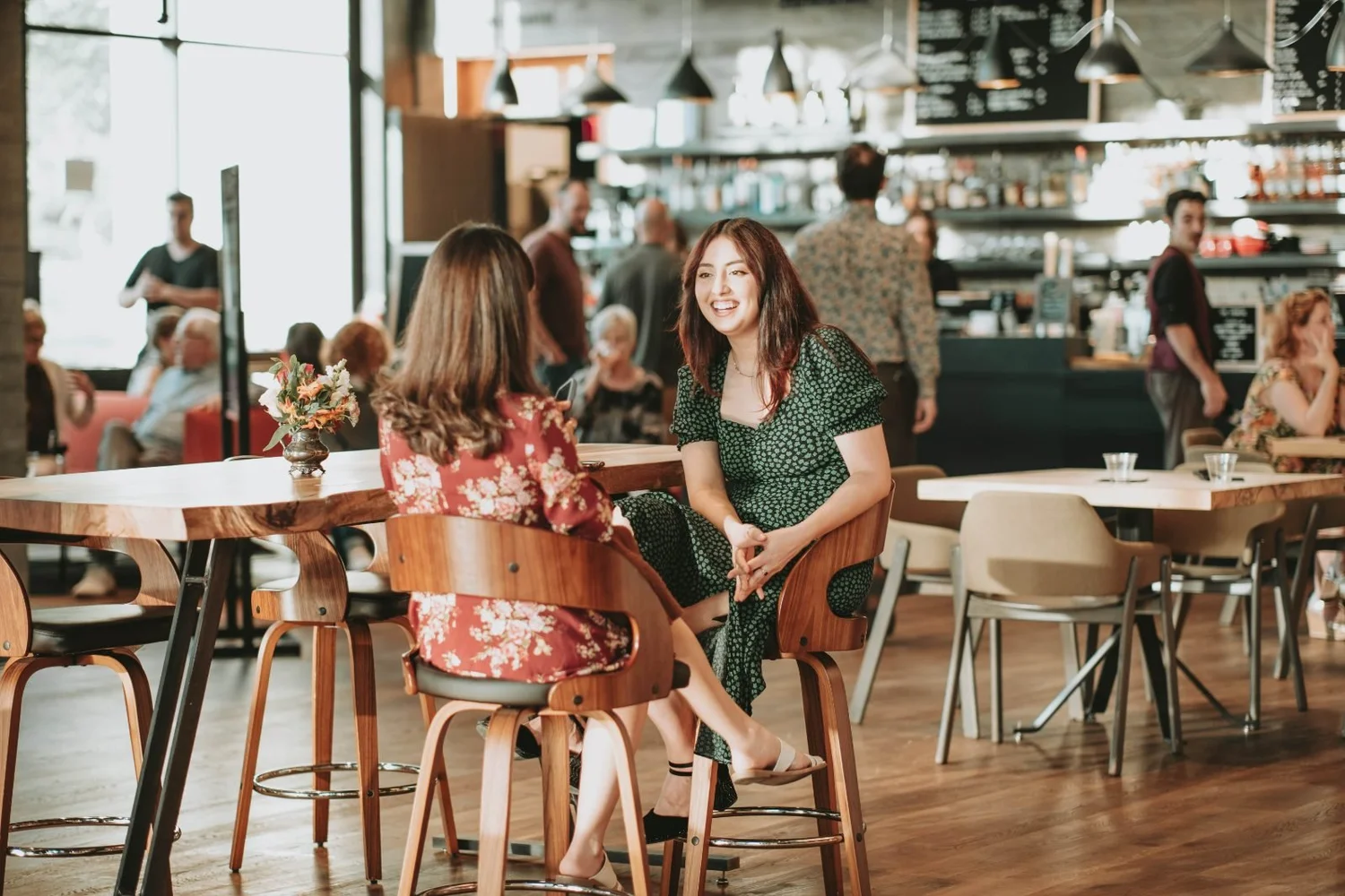 Two patrons talking in The Commons