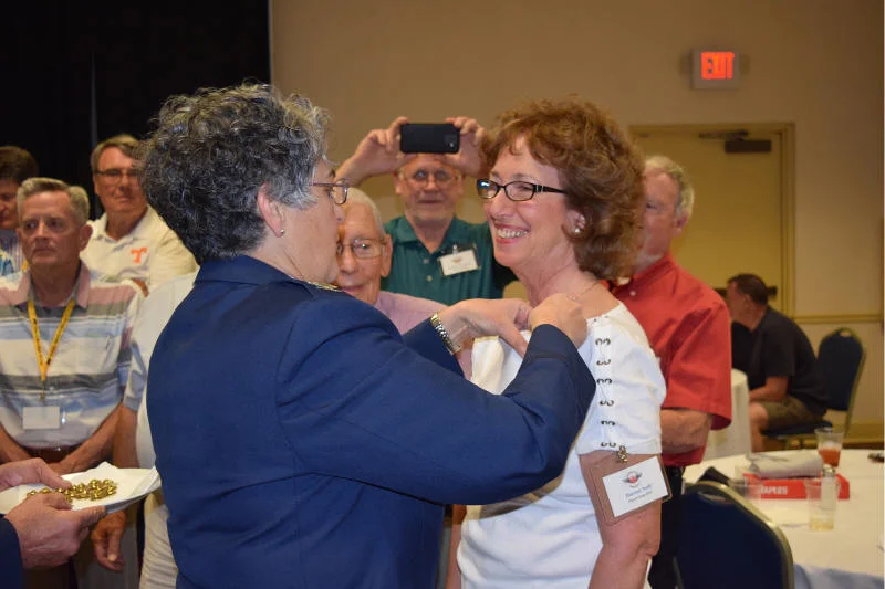 Morrone pinning smiling veteran.jpg