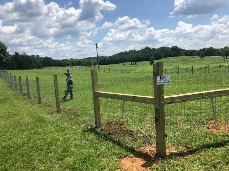 Welded wire farm fence with wood posts installed in Brentwood, TN — K & C Fence Company