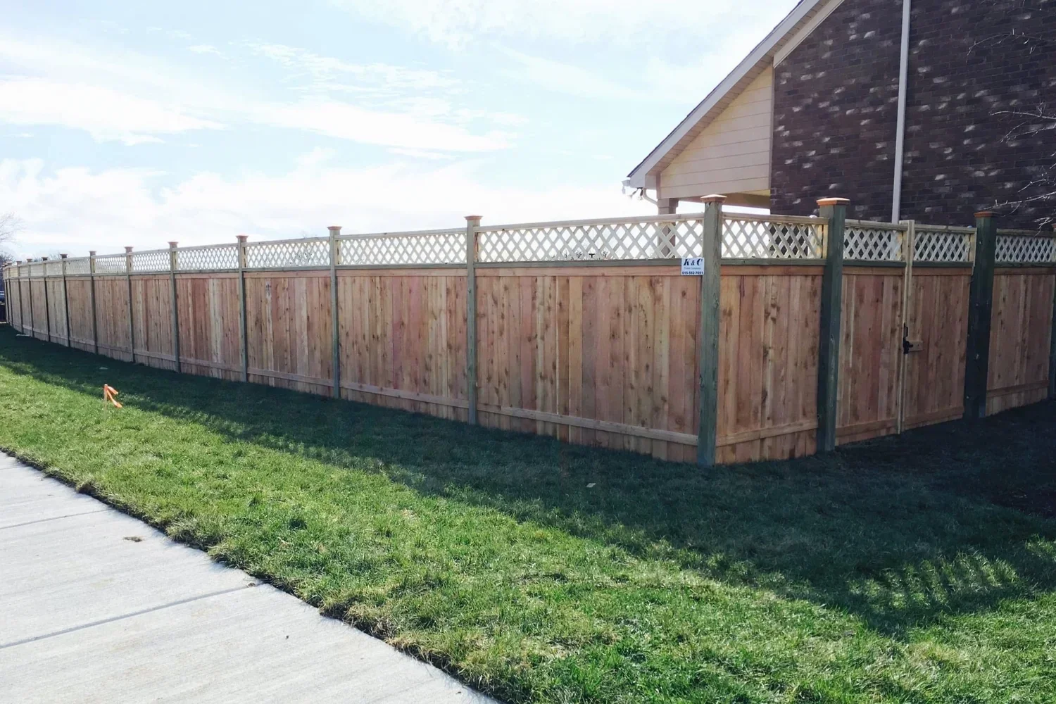 wood-privacy-fence-with-lattice-top-installed-by-kc-fence-nashville-tennessee.webp