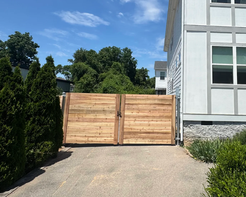 Horizontal Cedar Wood Driveway Gate Installation by K&C Fence in Nashville, TN
