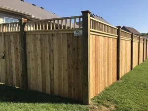 K&C Fence installed a cedar privacy fence with a decorative deck rail top in Nashville, Tennessee backyard property deck.