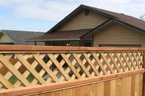 K&C Fence installed a lattice top wood privacy fence along a backyard property line in Nashville, Tennessee.