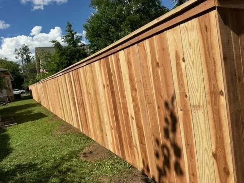 K&C Fence table top wood privacy fence lining a sunny residential yard in Nashville, Tennessee.