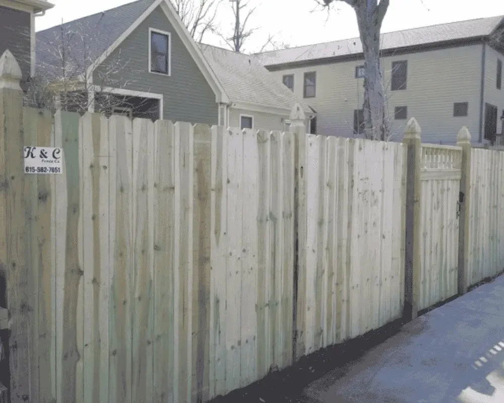 K&C Fence wood privacy fence with French Gothic posts installed beside a home in Nashville, Tennessee.