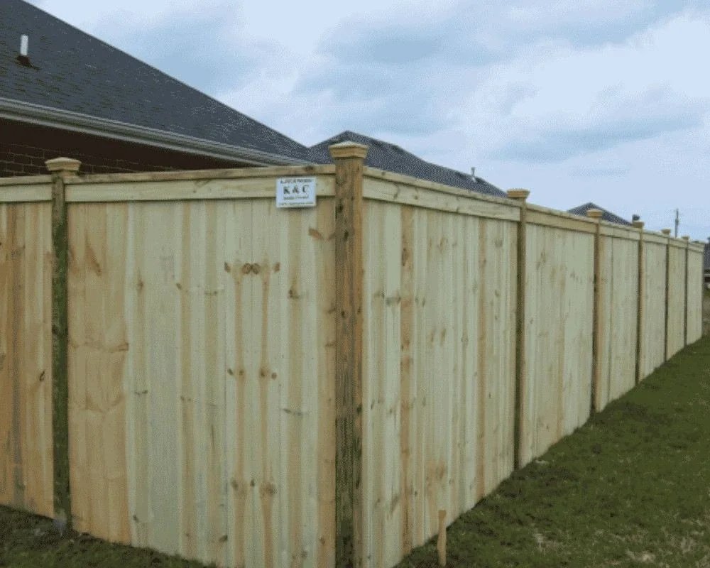 K&C Fence cap-and-trim wood privacy fence with recessed posts beside a Nashville, Tennessee home.
