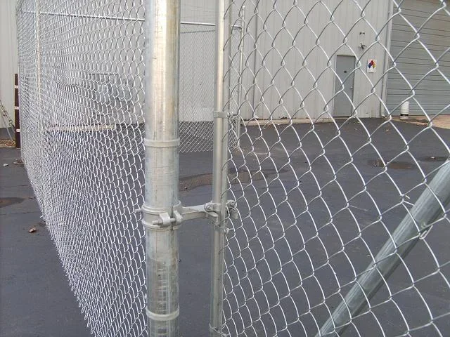 K&C Fence galvanized chain-link gate and latch securing a commercial property in Nashville, Tennessee.