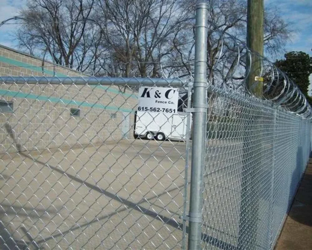 K&C Fence chain-link security fence with coiled razor wire protects a commercial property in Nashville, Tennessee.